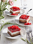 Four layer cake bars with raspberries and red currant