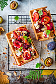 Waffles with ricotta and caramelized plums