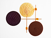 Three different chocolate lollies against a white background