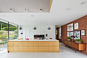 Open kitchen with brick wall in an architect's modern house