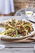 Grilled pointed cabbage with spring onions and raisins