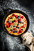Sweet pizza with fruit and berries