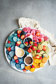 Colorful mini pancake muesli with berries