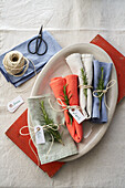 Linen napkins decorated with rosemary sprigs