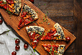 Hearty galette with tomatoes and black sesame seeds