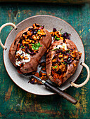 Baked sweet potatoes with chanterelle mushrooms and sour cream