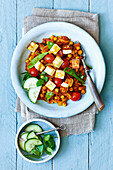 Medium spicy vegetable curry with chickpeas, tomatoes, and paneer