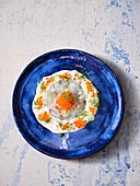 Carpaccio of Norway lobster with chive cream and trout caviar