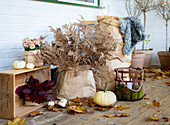 Coarse brown paper bags as planters on autumn porch