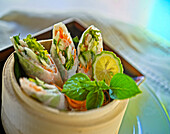 Summer rolls in bamboo steamer