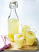 Homemade lemonade in glasses and bottle
