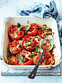Roasted peppers stuffed with cherry tomatoes, parmesan cheese, and basil
