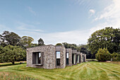 The offset façade of a house made of flint