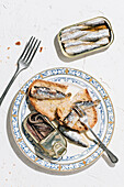 Top view of delicious plate of bread with sardines