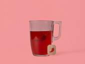 Aromatic hot spice pepper tea served on glass mug placed on colorful background