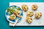 Mashed potato with cheddar cheese, bacon, and spring onions in baked potato skins