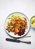 Classic hunter's schnitzel with spaetzle, mushrooms and cranberries