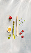 Asparagus spears, egg, watercress, radishes, raspberries, and peas
