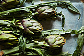Fresh artichokes with leaves
