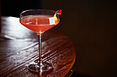 Blood orange cocktail on wooden table