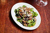 Meat ragout served with green tagliatelle