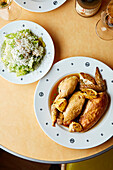 Boiled chicken served with romaine lettuce with parmesan cheese