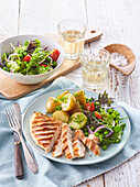 Chicken steak with potatoes and green salad