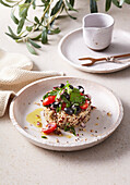 Quinoa vegetable salad with black olives