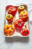 Stuffed puttanesca tomatoes