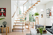 Stairs with wooden steps in a bright living room
