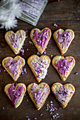 Marmalade hand pies in the shape of a heart with purple icing
