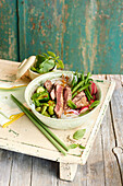 Asian steak salad with beans and radishes