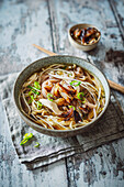 Vietnamese chicken soup with brown rice noodles and roasted shallots