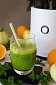 Green apple-orange juice with mint