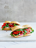 Serrano sandwich with tomatoes and rocket salad