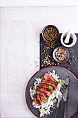 Beef steak with white pepper and garlic served on rice (Thailand)