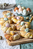 Yeast dough wreath with dragee eggs