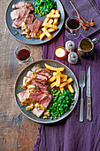 Steak with chips, peas and pepper sauce