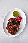 Roast lamb chops in spicy marinade with coriander paste