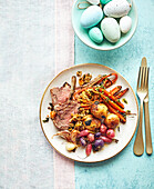 Lamb crown with caper and anchovy stuffing, herb-flavoured young potatoes and roasted radishes (Easter)