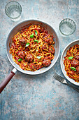 Spaghetti in a pan with meatballs