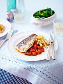 Roasted sea bass with puttanesca sauce and celery fries