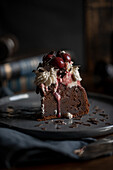 Chocolate cupcakes with cream and cherries