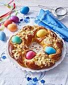Yeast wreath with colored Easter eggs