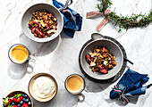 Festive Breakfast setting of Berry and Coconut Granola, Yoghurt, Fresh Berries and Coffee