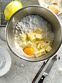 Ingredients for shortcrust pastry in mixing bowl