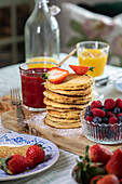 Banana-oat pancakes with fresh berries for breakfast