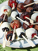 Berry skewers dipped in chocolate