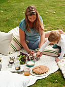 Vegetables with dip, giant sandwich, berry skewers, desserts and fruit cocktails for picnics