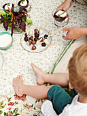 Chocolate-covered berry skewers for a picnic